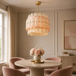 Rosara two-tier Murano glass drum chandelier above a round marble dining table with blush chairs