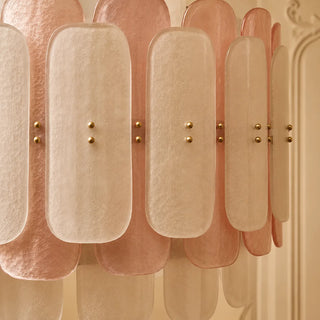 Close-up of the blush and white Murano glass paddles and brass ball studs of the Rosara chandelier