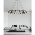 round copper chandelier installed above modern sectional sofa