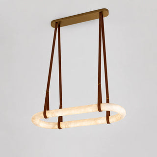 Sellara oval alabaster LED chandelier on camel leather straps with a beige canopy, front three-quarter studio view