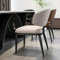 Side view of luxury off-white and brown dining chairs near a stylish black table