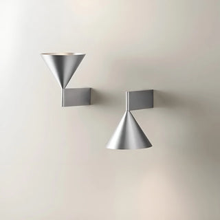 Brushed silver and black Bauhaus wall lamps in geometric cone design - minimalist aesthetic.