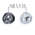 Elegant silver glass chandelier installed above a staircase, creating a floating bubble lighting effect.