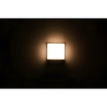 LED wall light emitting a soft 3000K warm glow against a dark background