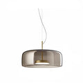 Modern Nordic pendant light with smoke gray glass shade and brushed gold fixture