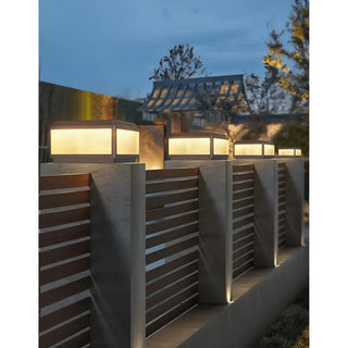 Row of MIRODEMI Solar LED Outdoor Pillar Lights with horizontal striped glass installed along a modern fence
