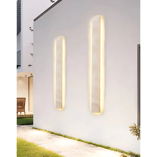 all Solea sconces casting ambient light on an elegant exterior wall at dusk
