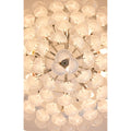 Close-up detail of textured glass chandelier with layered illuminated glass elements