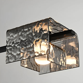 Close-up detail of textured glass shade with warm LED light and copper mounting hardware