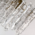 Detailed view of handcrafted textured clear Murano glass elements on a luxury chandelier