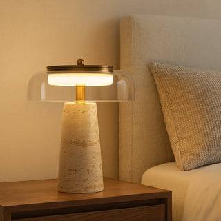 MIRODEMI travertine and glass bedside lamp emitting soft warm light in modern bedroom interior with wood nightstand