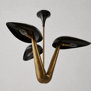 Trombara brass mid-century dome chandelier with three curved black shades and E12 candelabra bulbs, angled studio view