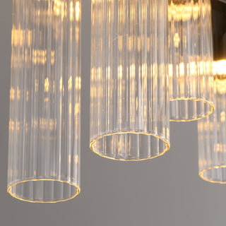 Close-up of lit fluted glass pendants on the Urban Minimalist chandelier