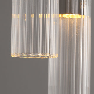 Close-up of the clear fluted glass tubes with warm LED glow