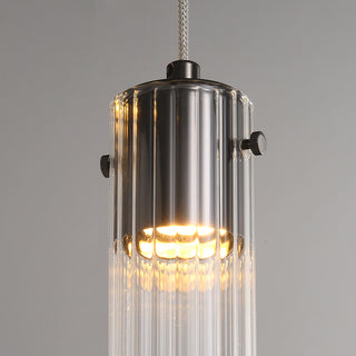 Detail of a fluted glass pendant with its silver-tone cap and suspension wire