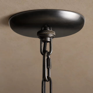 Black ceiling canopy and chain attachment detail on the Vellori pendant light