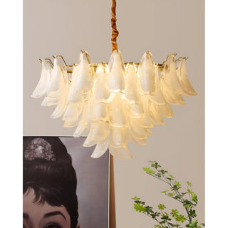 Luxury Velmira glass chandelier with layered frosted glass panels and warm golden lighting in modern interior