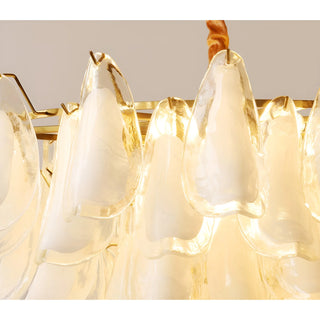 Detailed illuminated glass texture of Velmira chandelier with warm glowing light