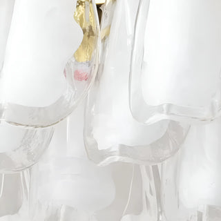 Close-up detail of Velmira rectangular chandelier with layered white frosted glass and polished brass accents