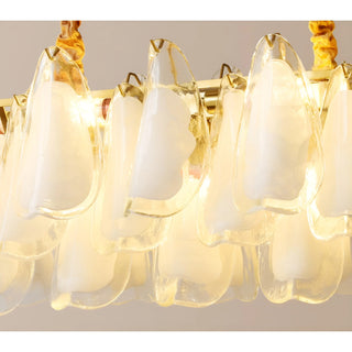 Illuminated Velmira rectangular glass chandelier featuring handcrafted frosted glass panels and warm ambient lighting