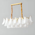 Studio view of Velmira rectangular modern chandelier with white glass elements and luxury brass suspension
