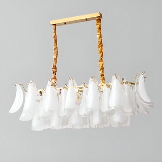 Studio view of Velmira rectangular modern chandelier with white glass elements and luxury brass suspension
