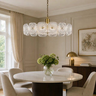 Clear Vetrara ring chandelier over a round marble dining table in a classic dining room