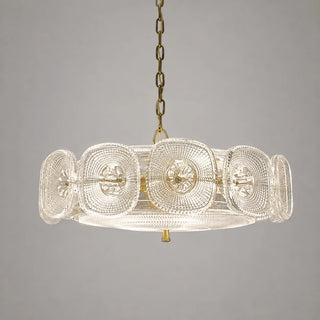 Clear Vetrara pressed-glass ring chandelier glowing warmly, angled studio view
