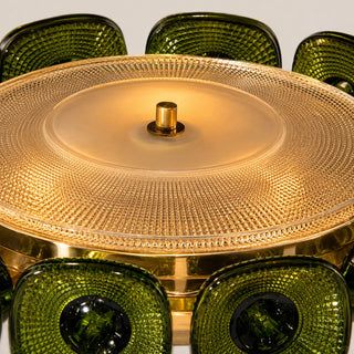 Detail of the green glass tiles and textured diffuser disc of the Vetrara chandelier