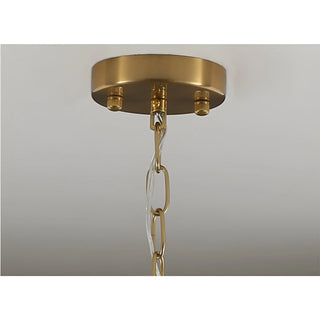 Brass ceiling canopy and adjustable suspension chain detail on Virella Murano glass chandelier