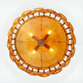 Illuminated bottom view of Viviana Mid-Century Glass Disc Chandelier in Amber