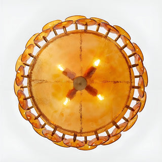 Illuminated bottom view of Viviana Mid-Century Glass Disc Chandelier in Amber