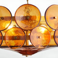 Close-up detail of amber glass discs on Viviana Chandelier