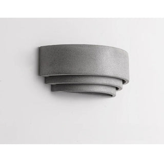 Unlit grey Wabi-Sabi outdoor sconce showing sculptural microcement finish and curved form