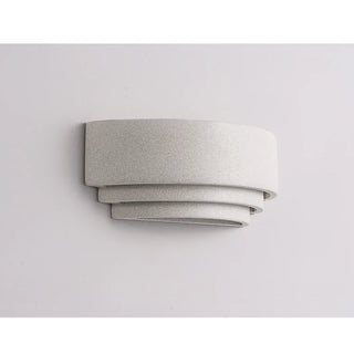 Close-up of Wabi-Sabi wall light in white finish with sculptural stepped form