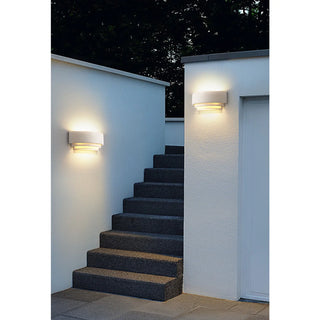 Wabi-Sabi wall light in white illuminating modern outdoor stairs with soft warm glow