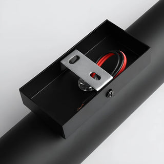 Close-up of wall light mounting hardware and internal wiring