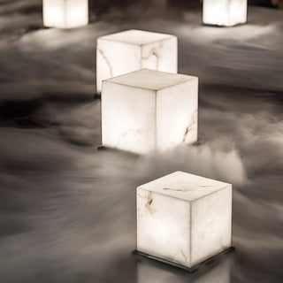 Waterproof LED marble cube lamps glowing softly in garden mist - modern outdoor lighting solution by Mirodemi