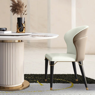 Dining chair with leather upholstery and carbon steel legs, minimalist modern