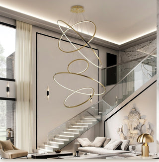 Gold ring light fixture for a staircase