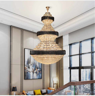 Long crystal chandelier cascading down a staircase
